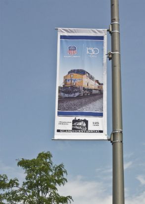 Union Pacific Arlington Heights.  Avenue banner announcing an anniversary.