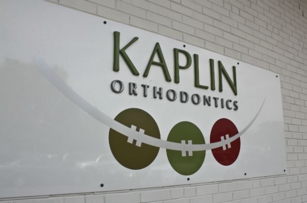 Kaplin Orthodontics Arlington Heights.  Aluminum panel with dimensional acrylic letters make this sign unique and durable. 