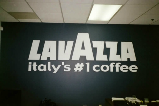 Lavazza.  4ft high by 10ft wide in the lobby.