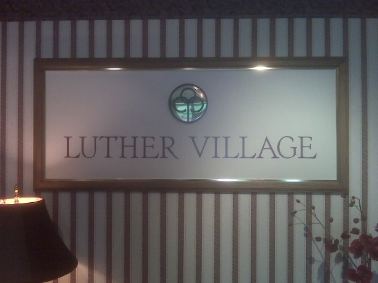 Luther Village.  Custom frame with logo and lettering. 
