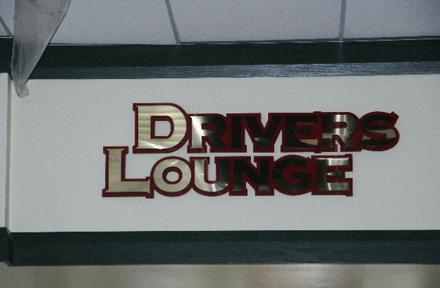 Shiny gold laminate face on acrylic dimensional letters.