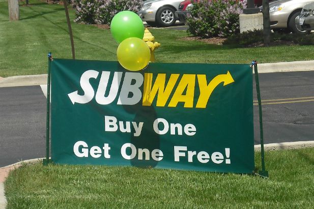 A commonly requested &quot;buy 1 get 1&quot; doublesided banner with brass grommets for mounting.