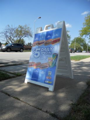 Sidewalk sign advertising the daily deals.
