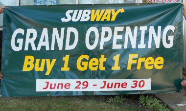 Grand opening banner featuring a &quot;by 1 get 1&quot; deal. 